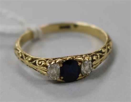 An 18ct gold sapphire and diamond three stone ring, size Q.